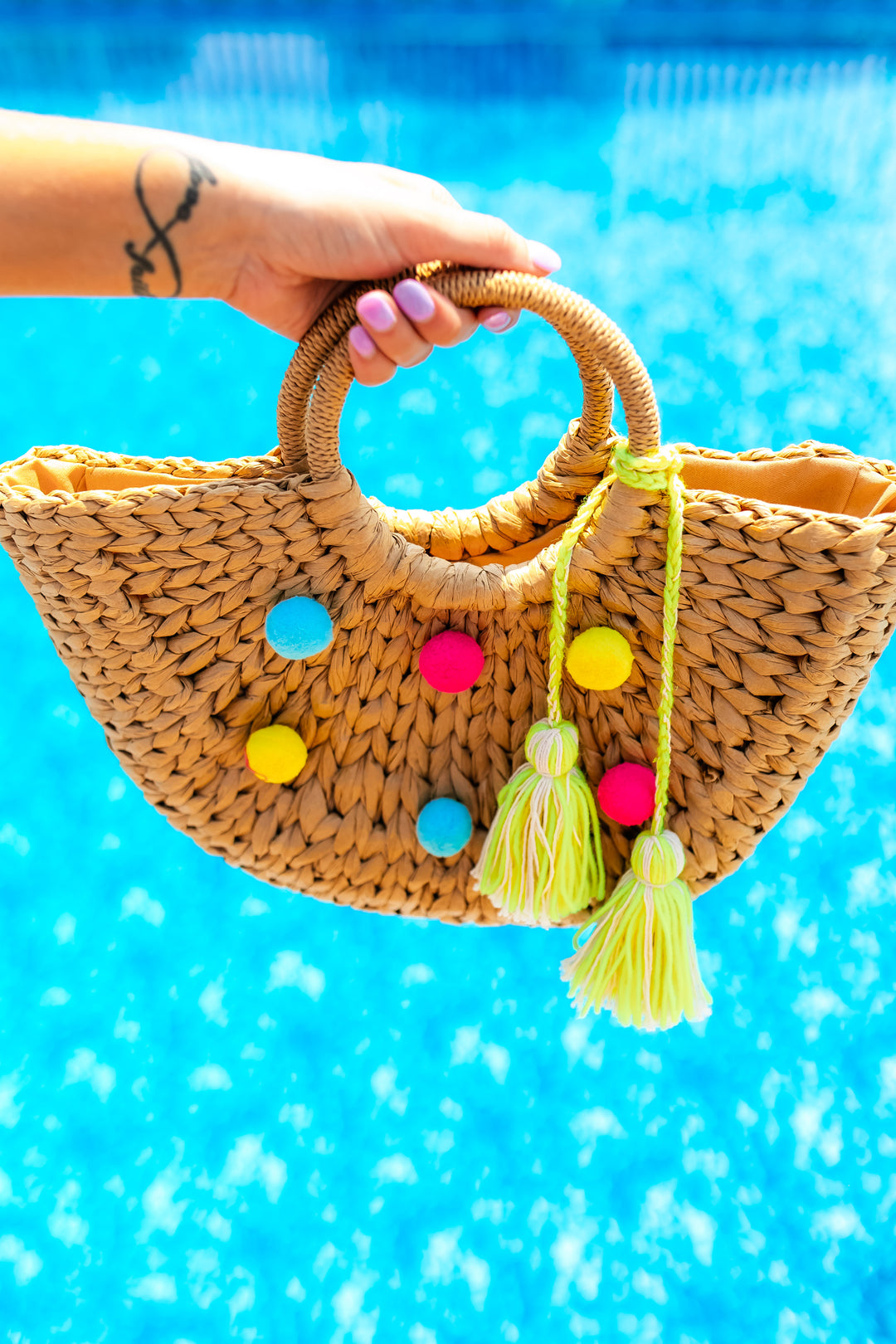 The Straw Woven Pom Bag