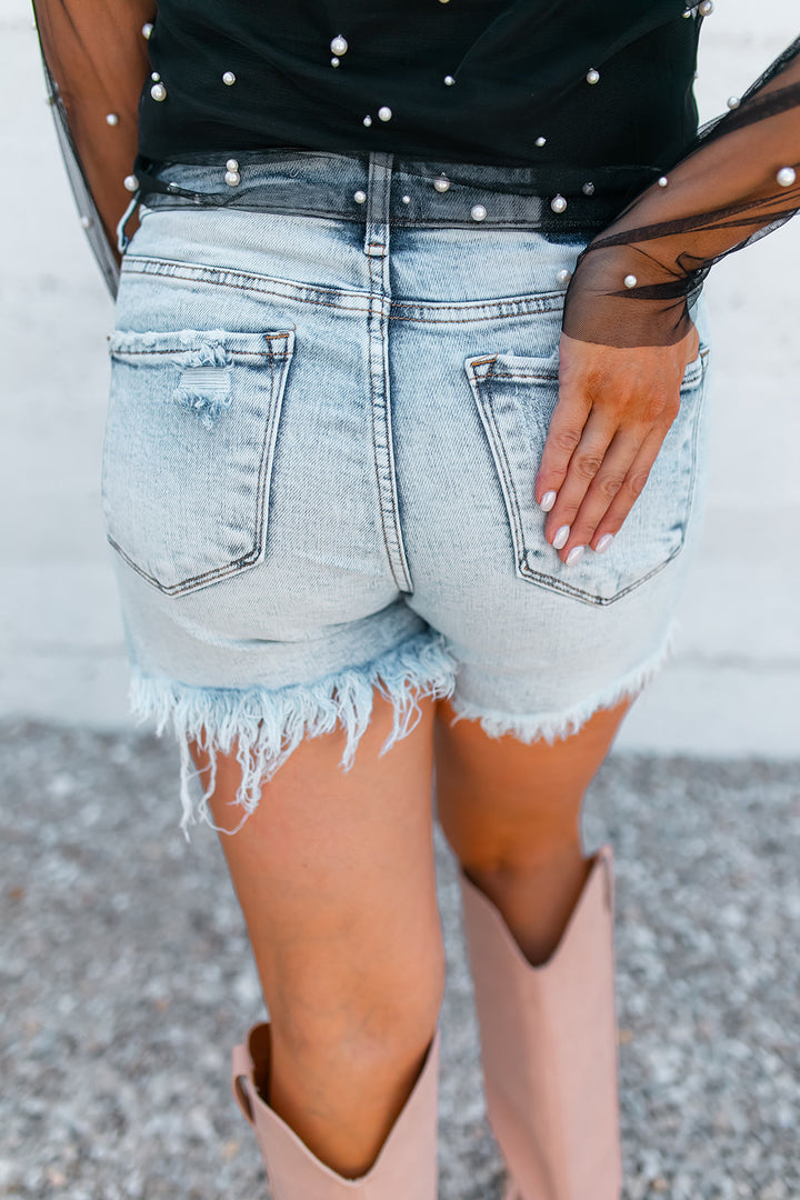 The Allison High Rise Distressed Denim Shorts