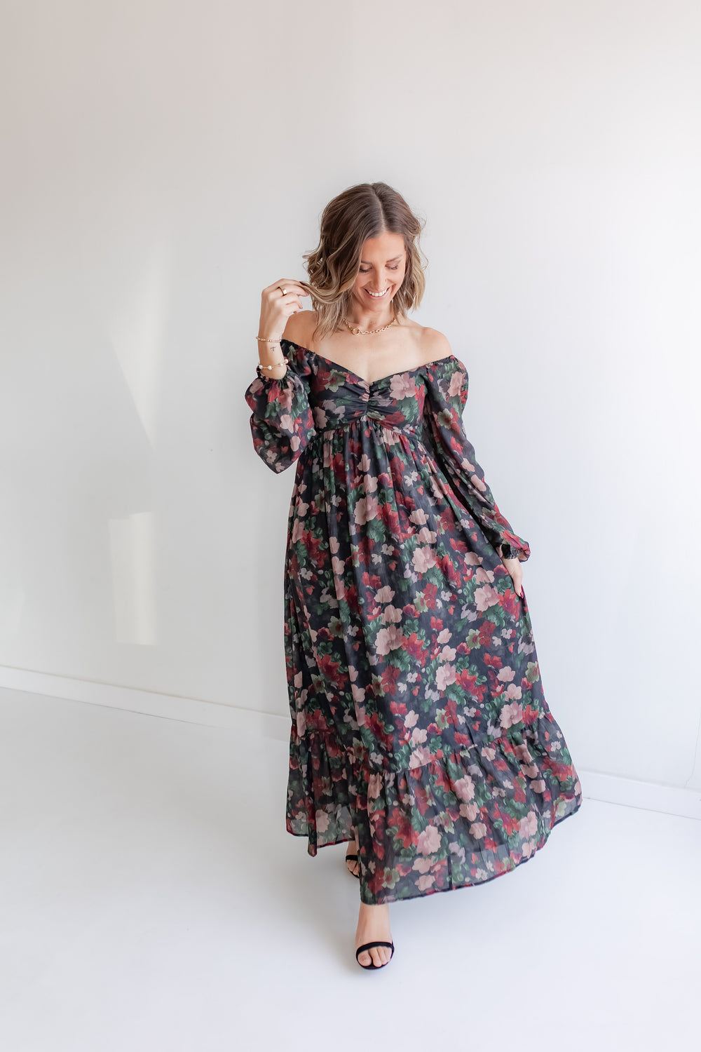 Holiday floral maxi dress for family photos with off the shoulder detail and sweetheart neckline