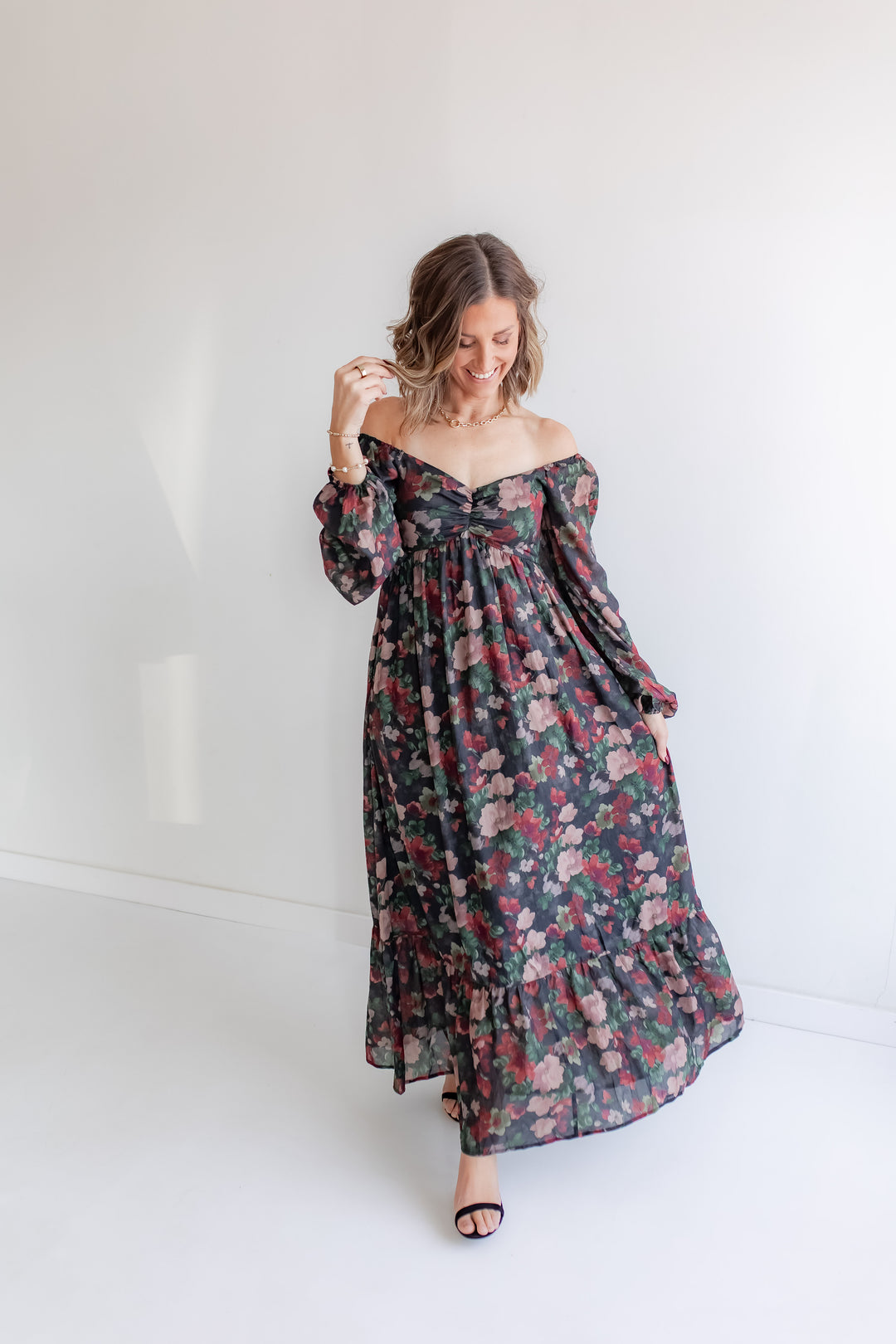 Holiday floral maxi dress for family photos with off the shoulder detail and sweetheart neckline