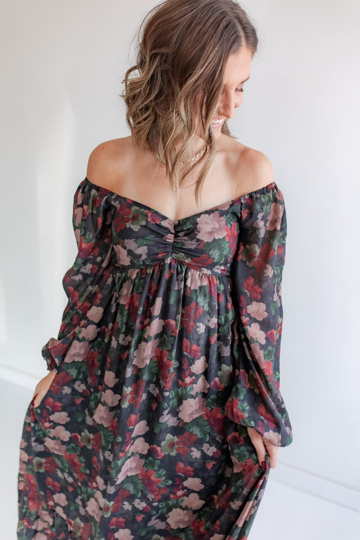 Festive winter floral dress with red and green floral detail and sweetheart neckline