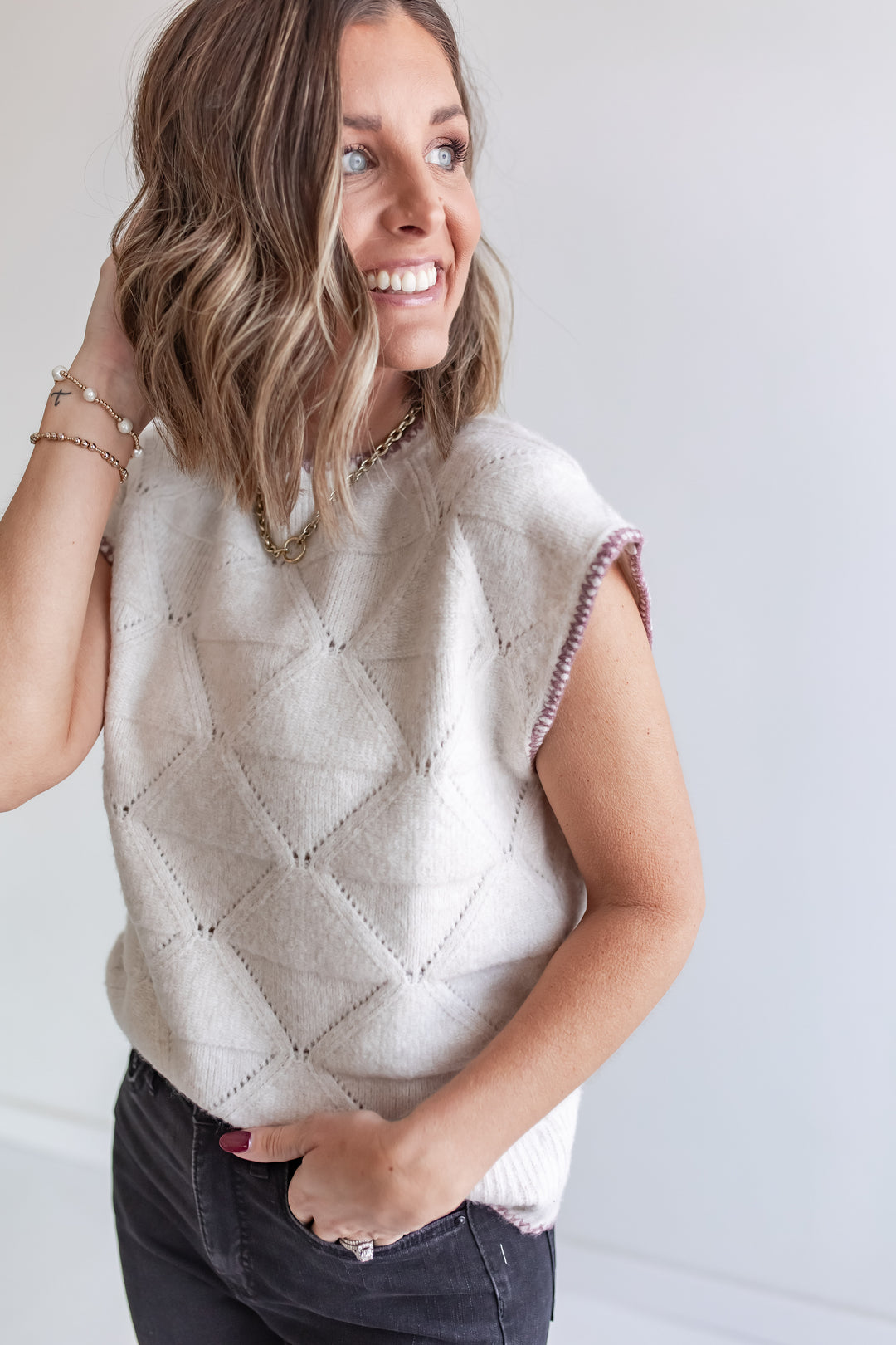 Women’s cream knit sweater with contrast wine trim