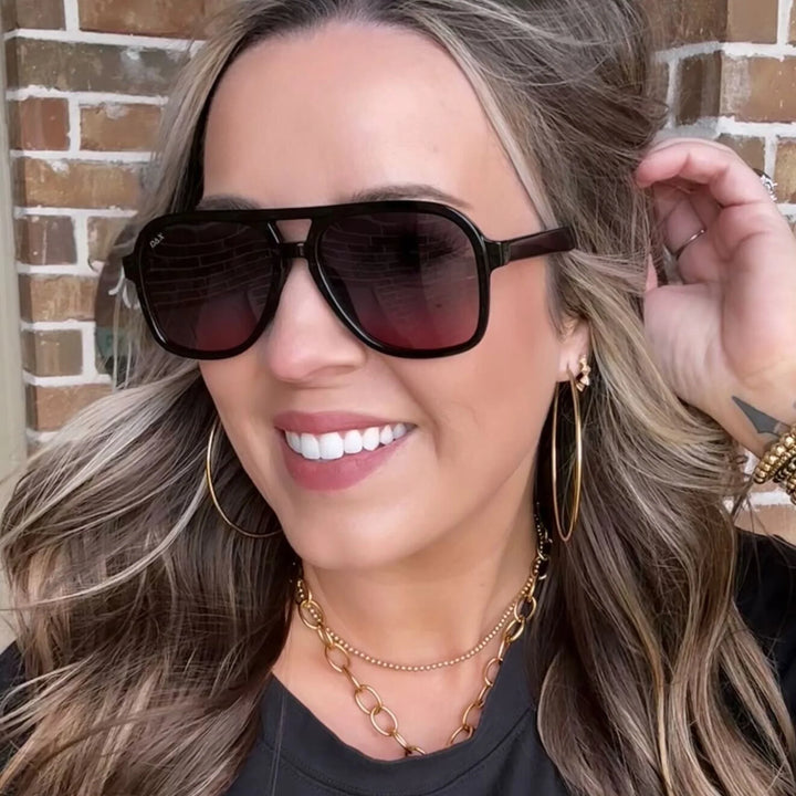 Woman wearing the Cruz sunglasses in smokeshow