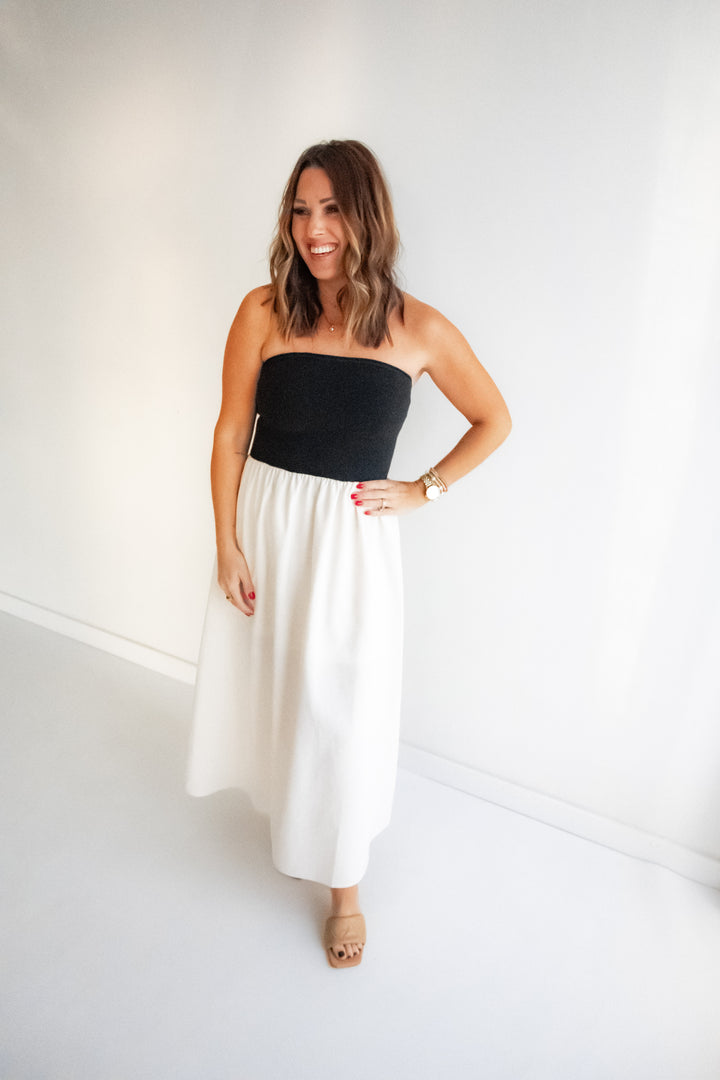 Woman wearing a Black and ivory contrast maxi dress