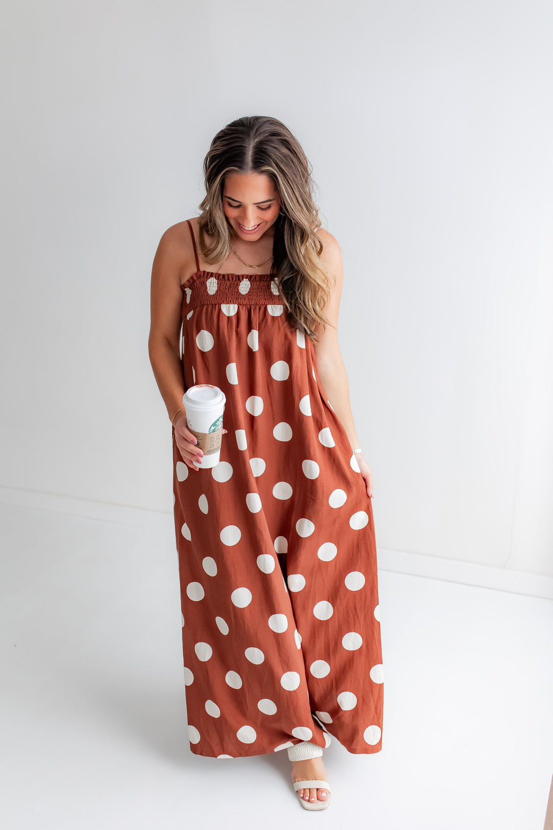 Brown & white polka dot maxi dress on model