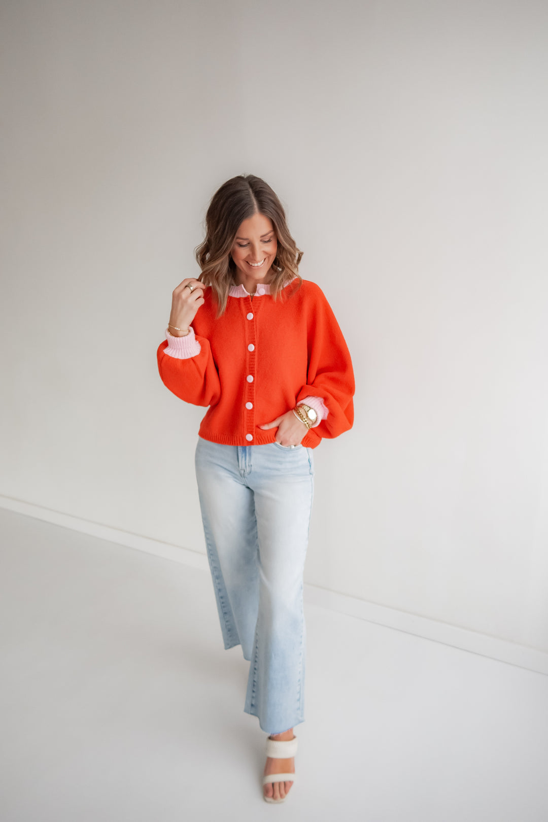 Women’s coral knit cardigan with pink accents