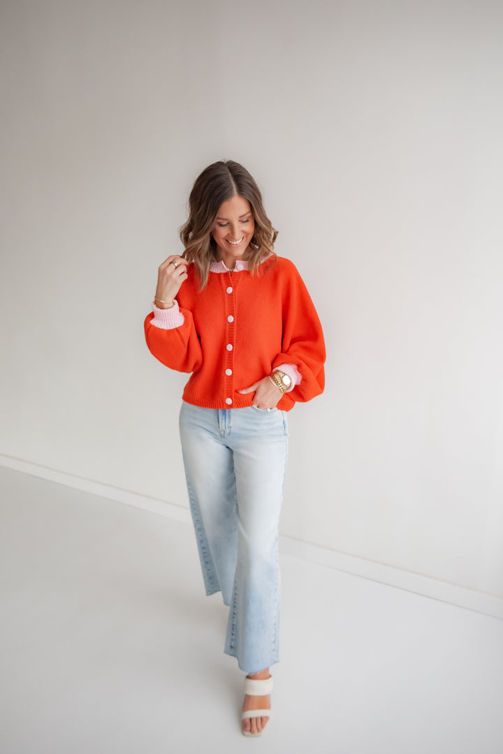 Women’s coral knit cardigan with pink accents