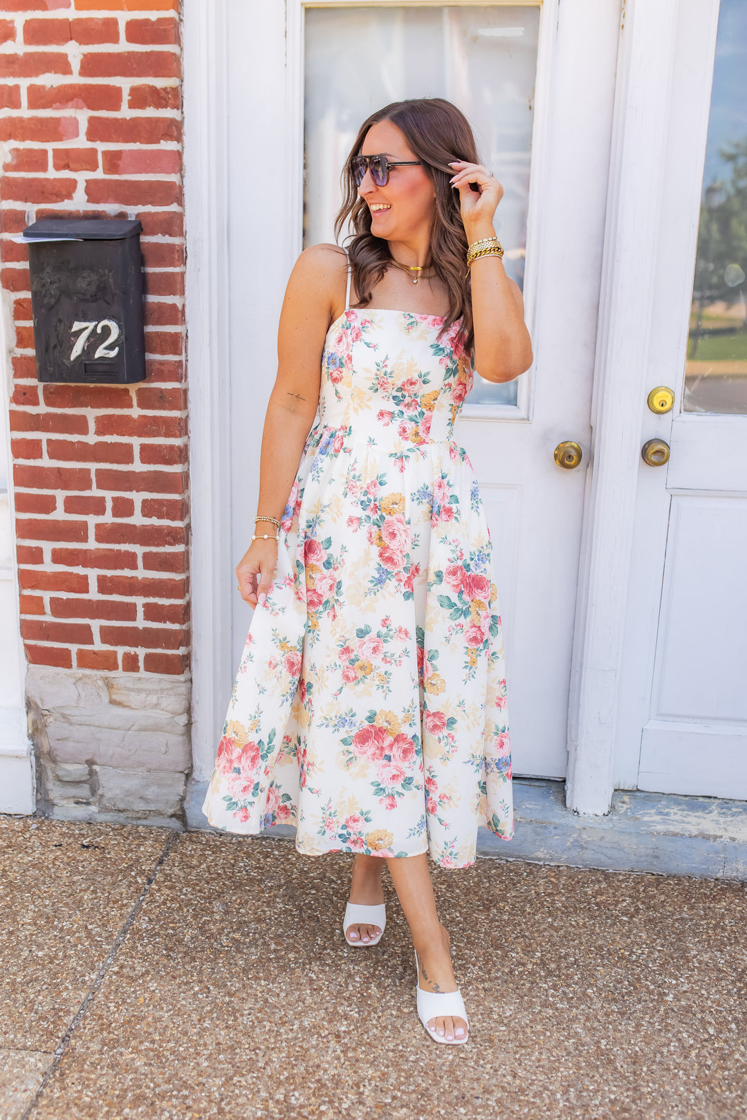 Cream floral midi dress for women styled as a spring outfit with a flowy skirt