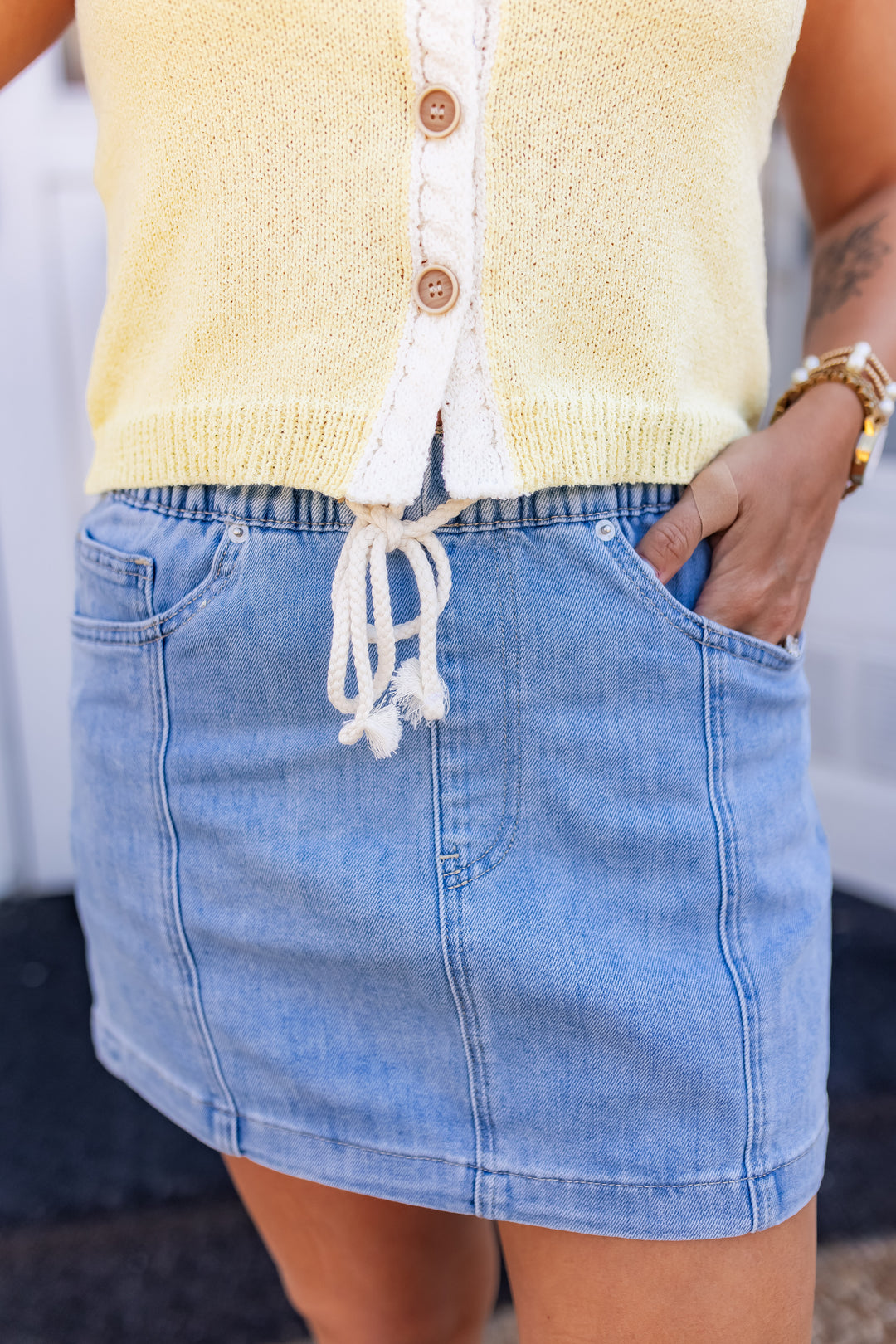 Elastic waist pull-on denim mini skirt detail with lightweight fabric