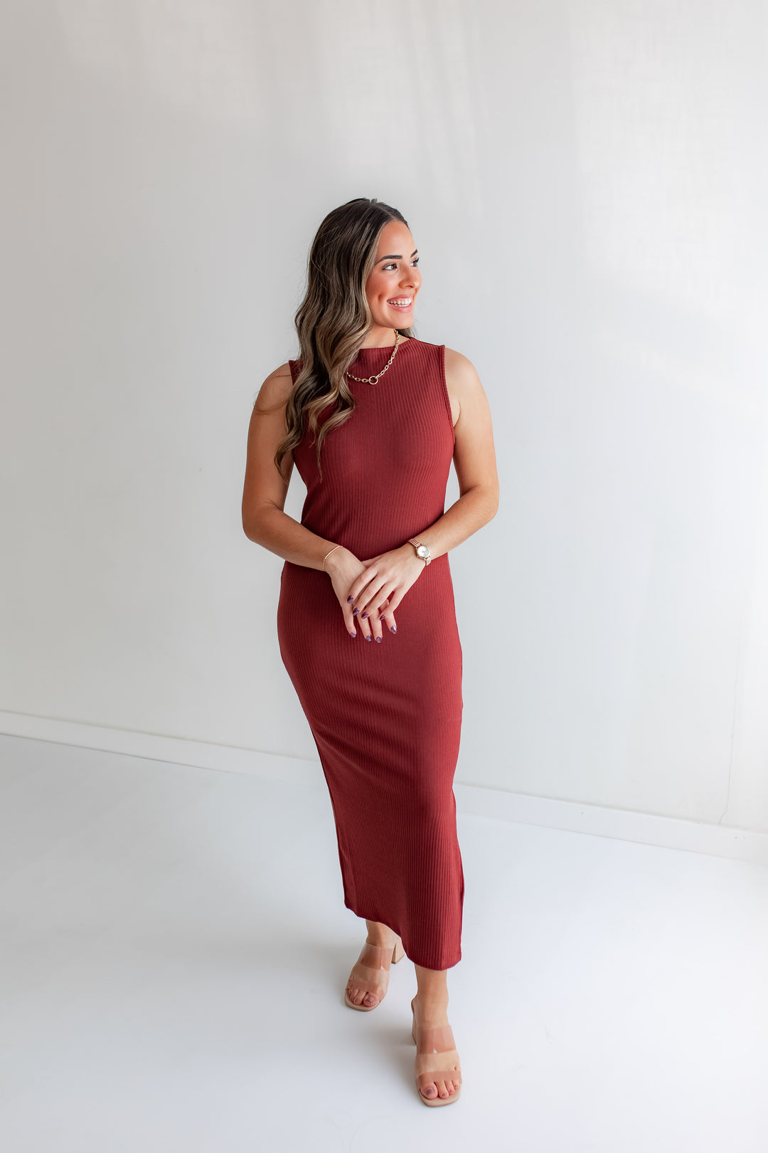 Rust fitted midi dress styled for fall