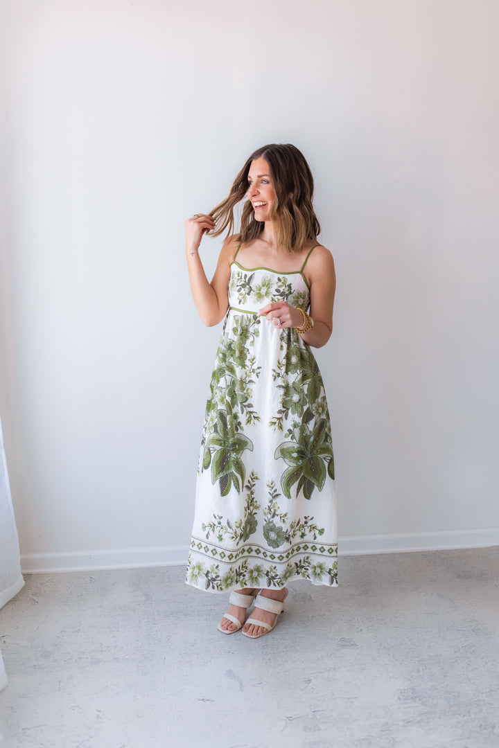green floral midi dress with spaghetti straps styled for spring and summer
