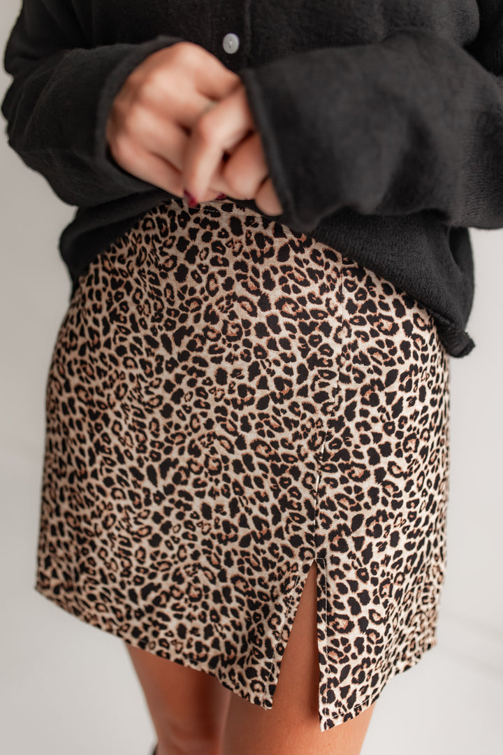 Leopard print mini skirt with a black sweater