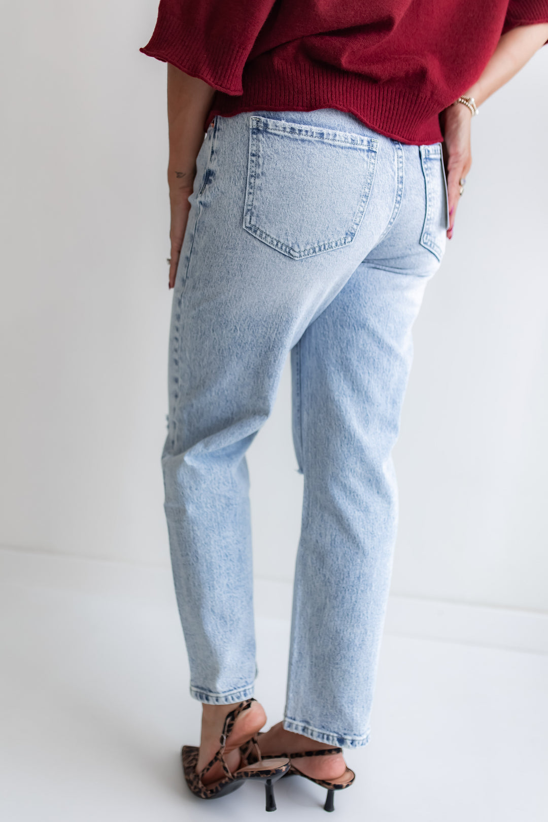 back view of slim straight light wash high rise Mica denim