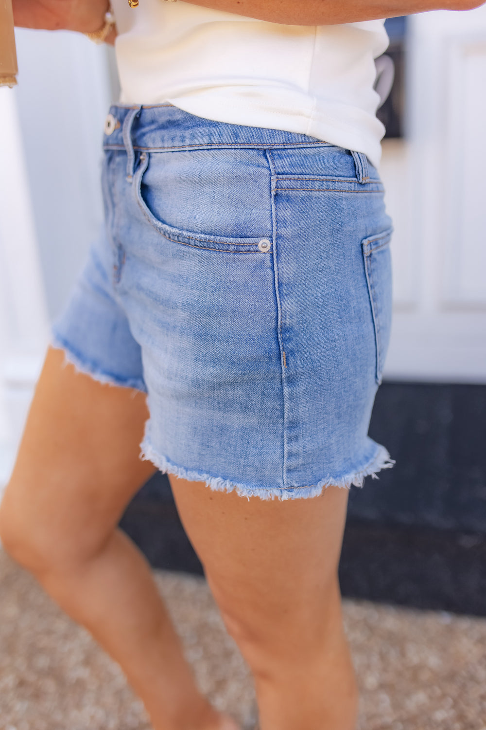 Mid rise stretch denim shorts with front pocket detail