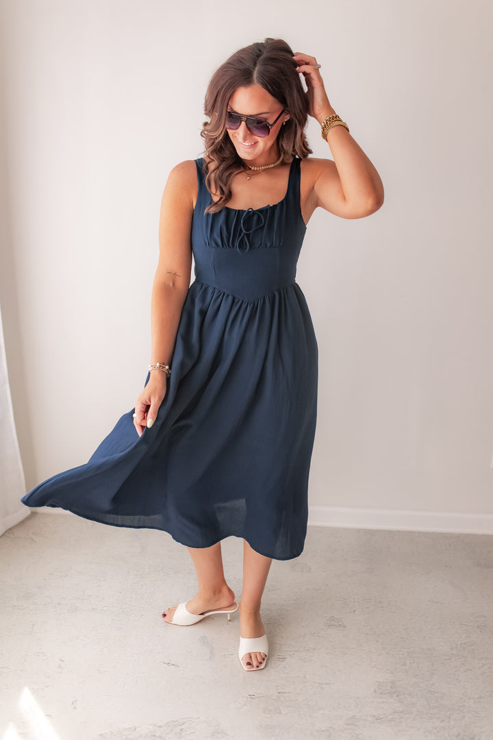 navy midi dress with flowy silhouette and flattering fit