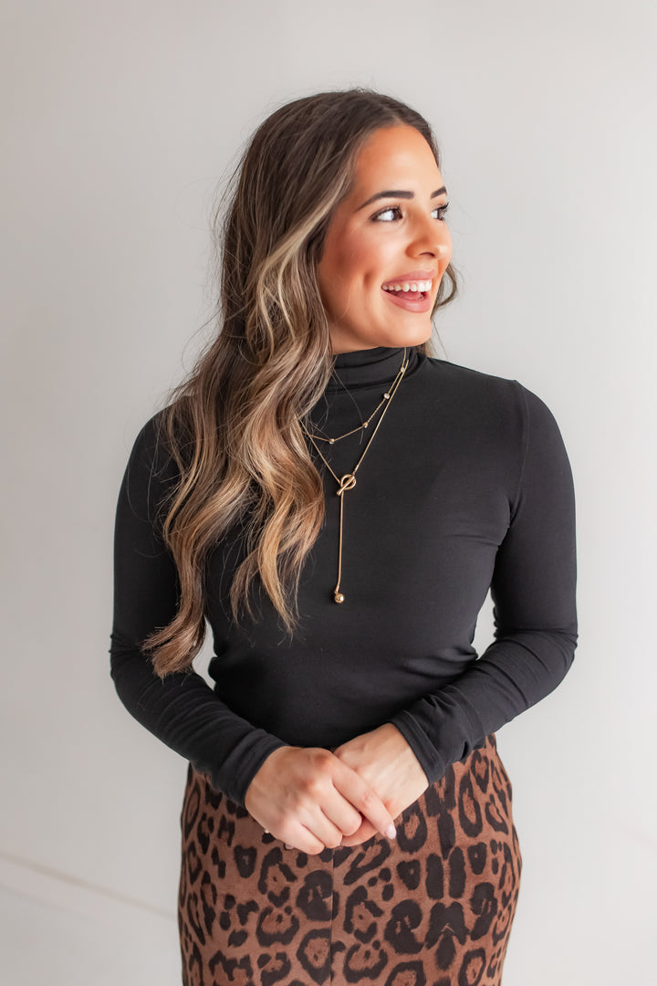 Signature Sleeve Turtleneck Black Top for women