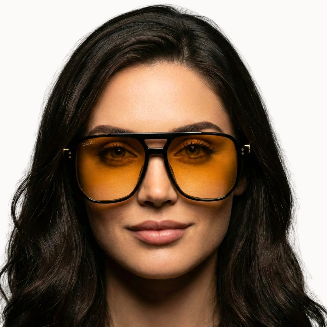 Trendy yellow lens sunglasses on a model