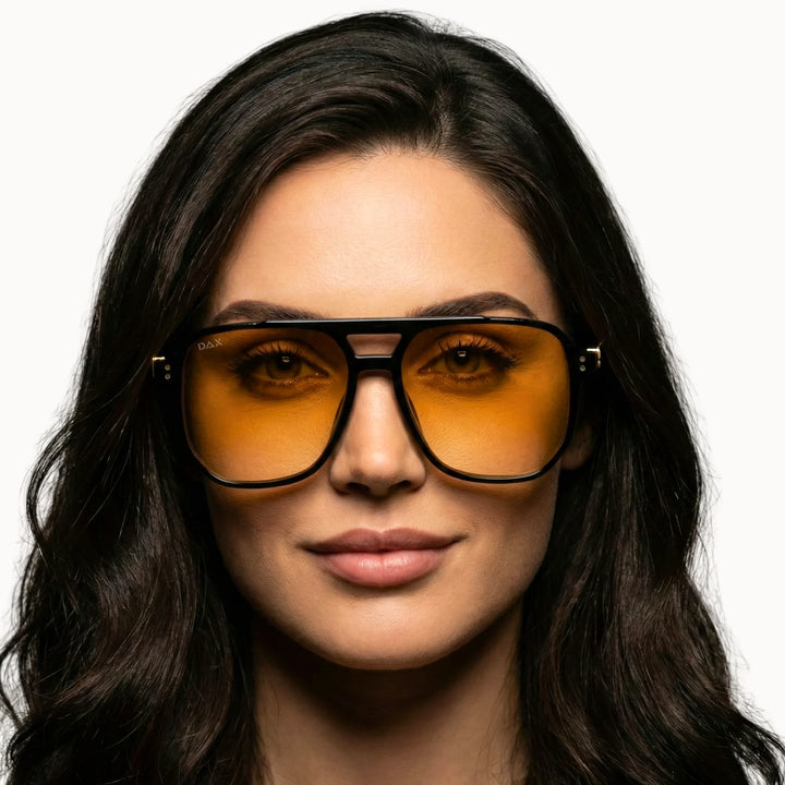 Trendy yellow lens sunglasses on a model