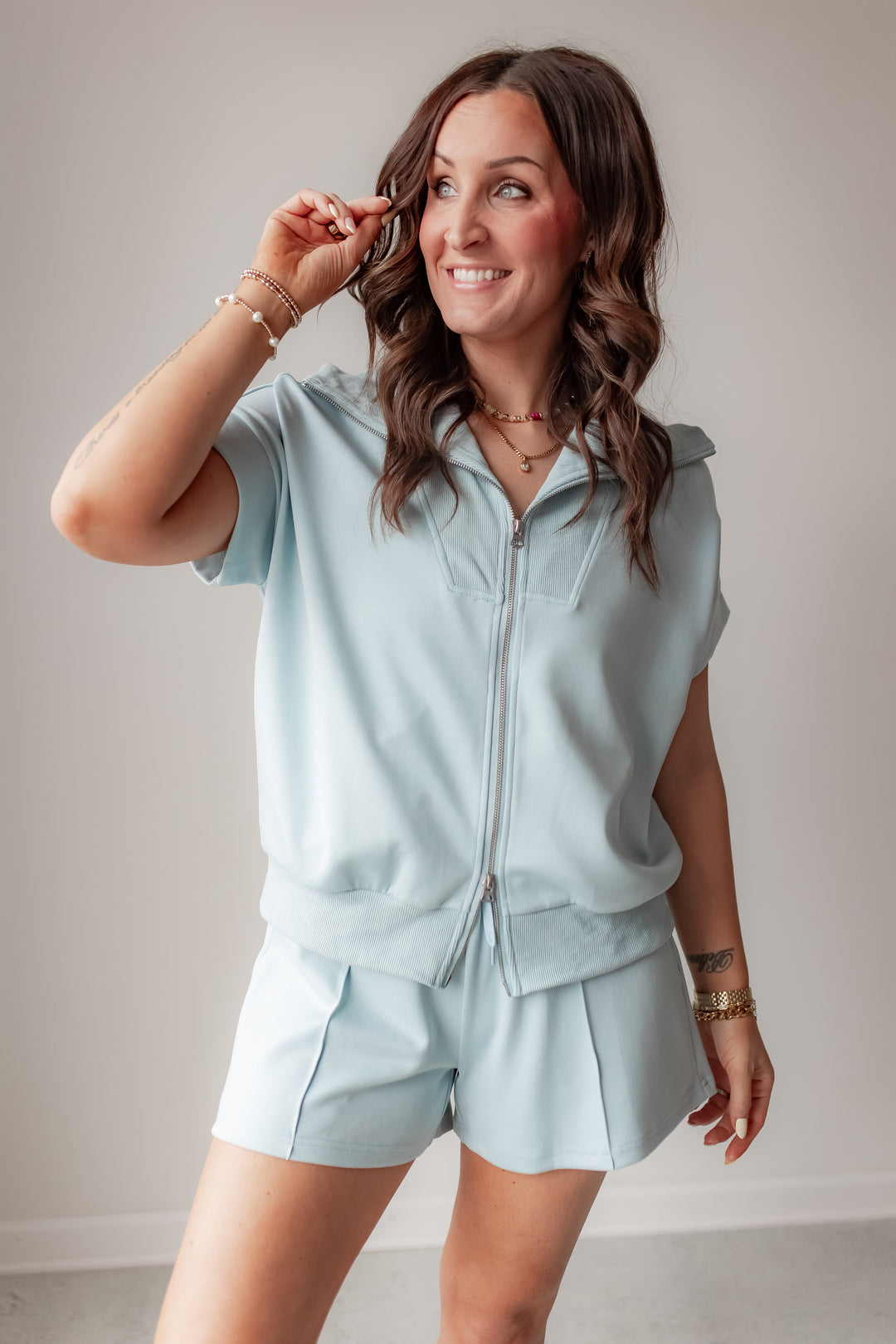 blue soft zip up lounge top with relaxed fit and short sleeves