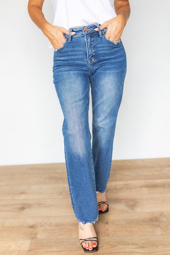 Front view of high rise straight leg jeans with white tee and black heels