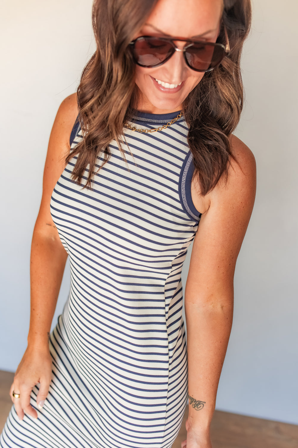 Detail view of striped midi dress with fitted silhouette