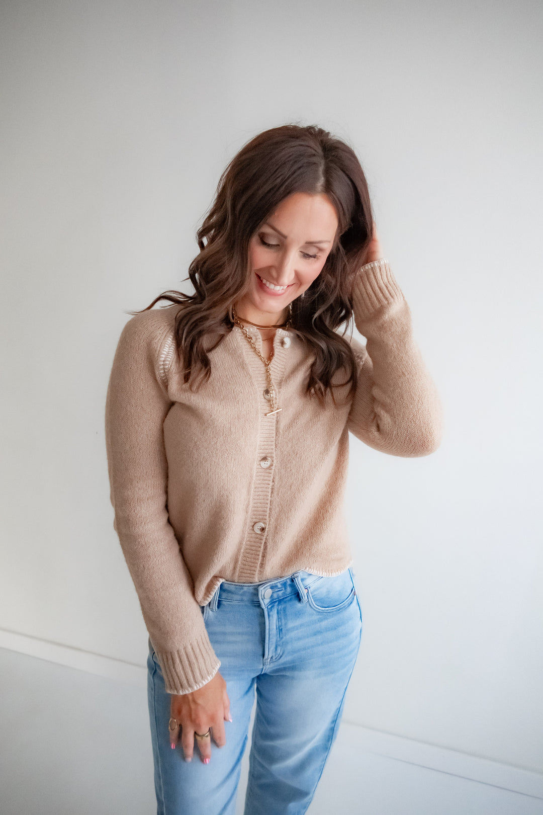 Neutral cardigan with blush detail for everyday wear