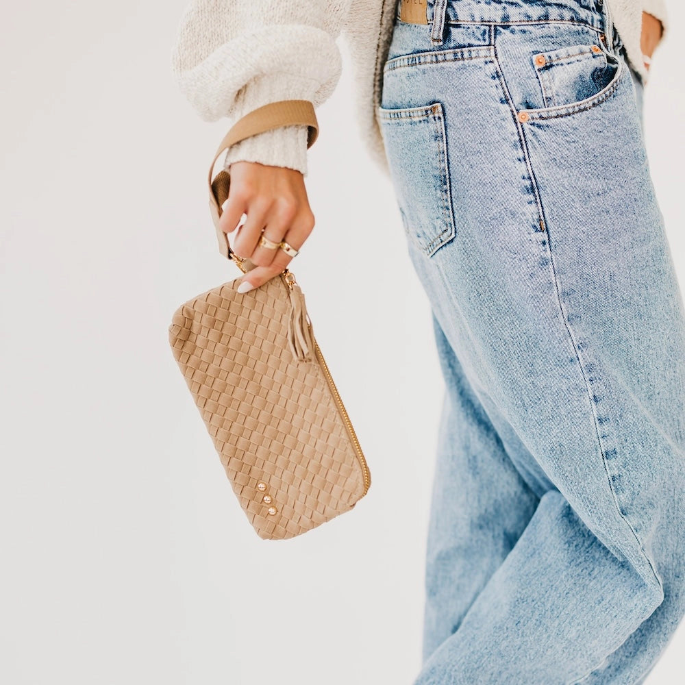Taupe woven suede clutch with tassel zipper pull and wristlet strap