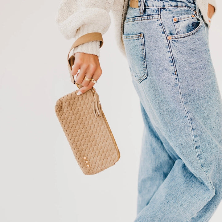 Taupe woven suede clutch with tassel zipper pull and wristlet strap