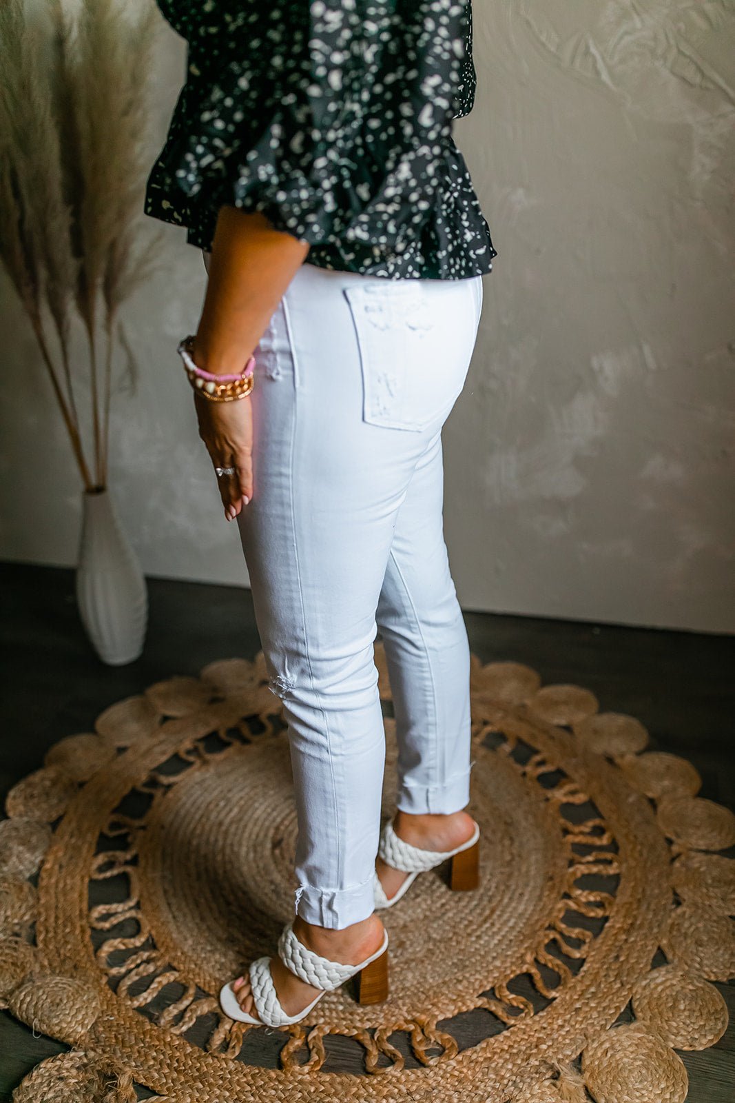 One Eleven Olive Boutique The Haylie White Denim  The Haylie White Denim is one of those staples you NEED!! They have stretch with mild distressing around the waist, pockets and knee. It has a cuffed ankle and a hi