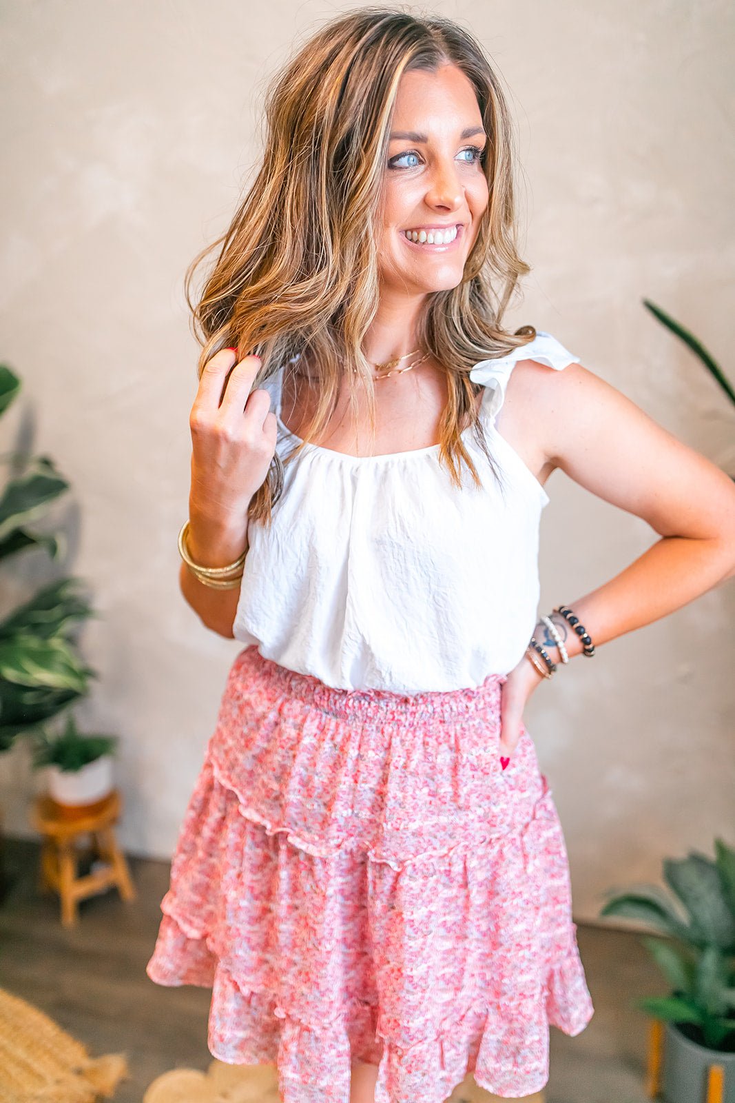 One Eleven Olive Boutique The Madison Mini Skirt The Madison Mini Skirt is the perfect piece to add a pop of fun to any outfit. With its shades of red, pink and green floral print, this skirt is sure to stand out! 