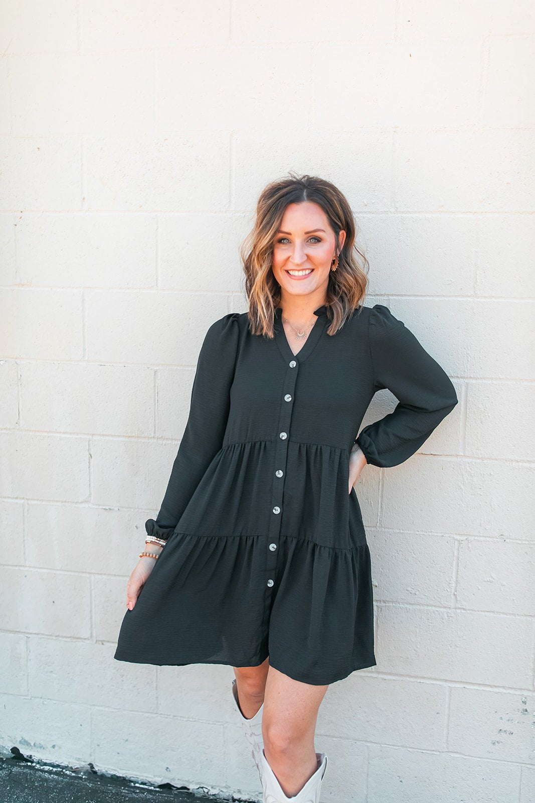 One Eleven Olive Boutique The Riley Button Up Dress (S-2XL) - Black If you are in need of a flattering and easy throw together outfit, look no further than the Riley Button Up Dress! The black color, the tiers, the buttons..the pocke