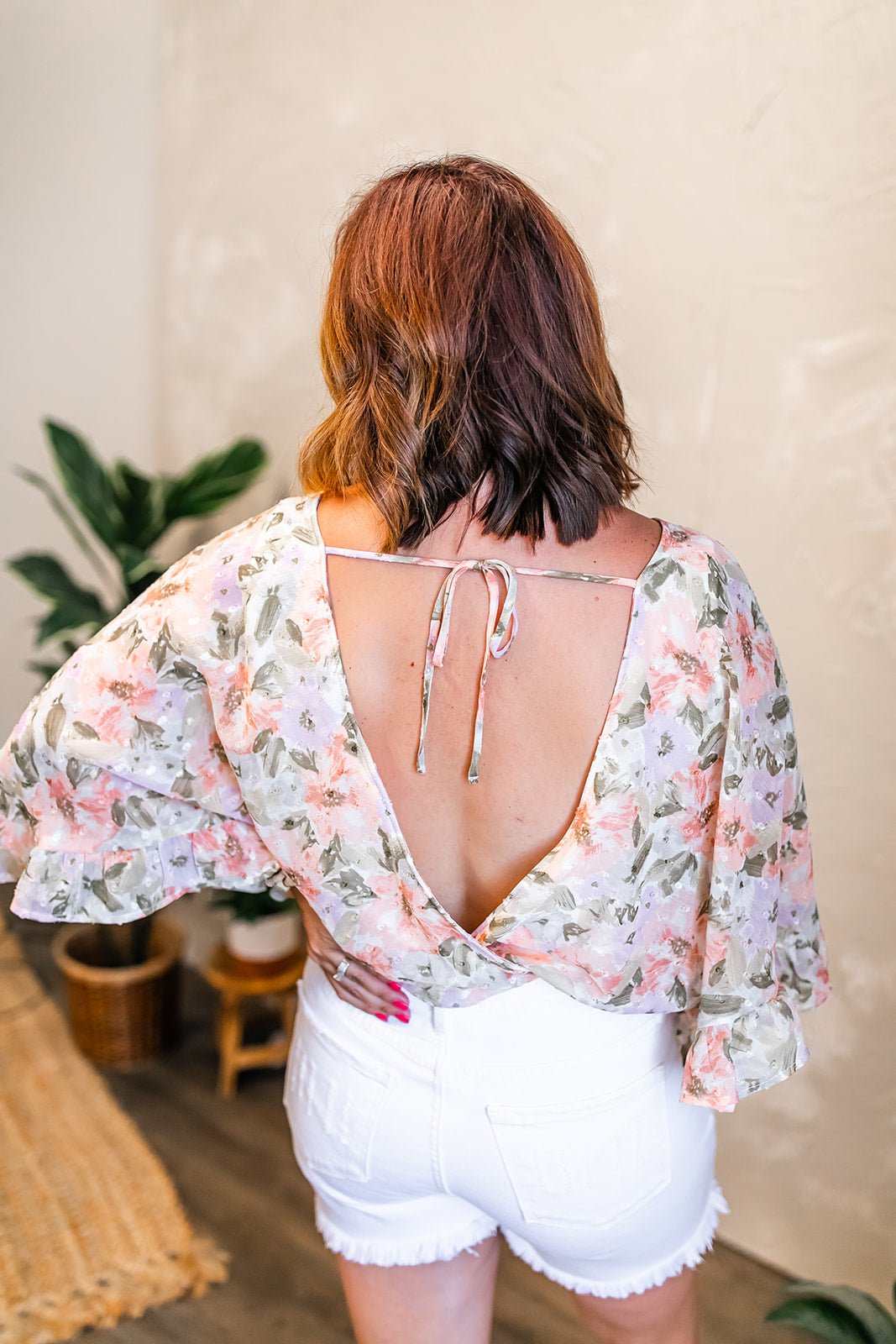 One Eleven Olive Boutique The Rosa Bodysuit Isn't she lovely?! The Rosa Bodysuit features a gorgeous floral detail throughout and a fun flared sleeve detail! This beauty is perfect for summer with it's lightwe