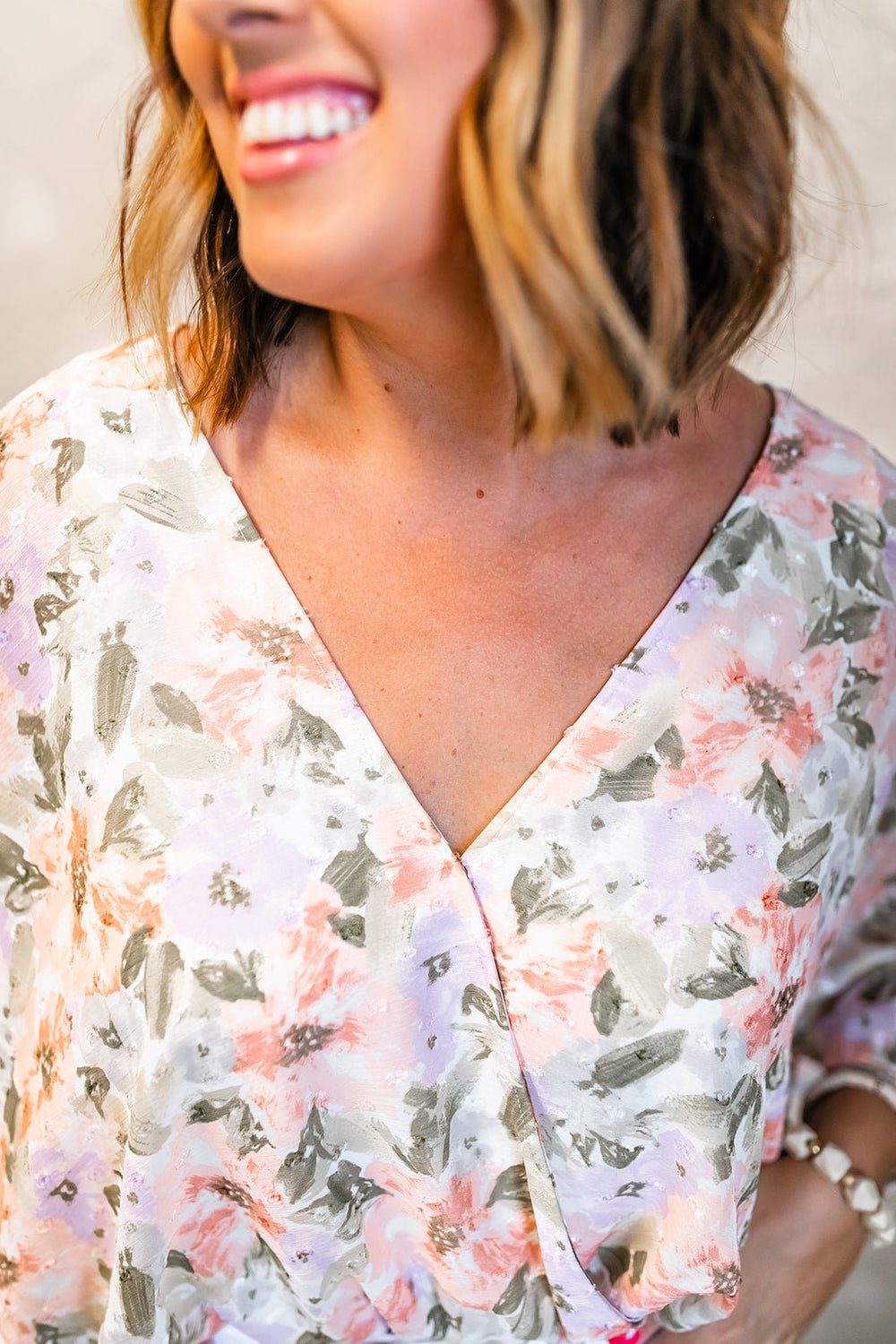 One Eleven Olive Boutique The Rosa Bodysuit Isn't she lovely?! The Rosa Bodysuit features a gorgeous floral detail throughout and a fun flared sleeve detail! This beauty is perfect for summer with it's lightwe